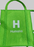 Green bag with 'Humana' logo on a patterned surface