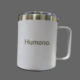White mug with 'Humana' branding on a wooden surface