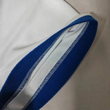 Actual Green/White Humana custom polo, close-up of navy sleeve cuff stitching