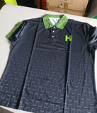 Actual Black/Green Humana custom polo, front view with green collar and chest H